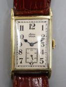 A gentleman's 1930's 14k Alpina Gruen manual wind wrist watch, with rectangular Arabic dial and