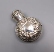 A late Victorian glass scent bottle with repousse silver hinged case, by William Comyns, London,