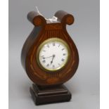 An Edwardian inlaid mahogany lyre shaped mantel timepiece H.26cm