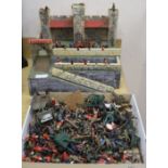 A quantity of Britains and other diecast military figures with fort.