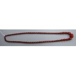 A single strand simulated cherry amber barrel shaped bead necklace, gross weight 84 grams, 96 cm.