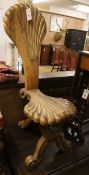 A carved olive wood side chair H.96cm