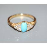 An early 20th century 18ct, single stone turquoise and six stone diamond set dress ring, size T/U.