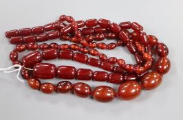 Two simulated cherry amber necklaces, gross weight, 102 grams.