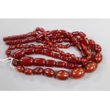 Two simulated cherry amber necklaces, gross weight, 102 grams.