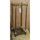 A late Victorian brass and iron four division stick stand H.58cm