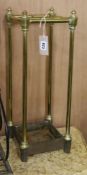 A late Victorian brass and iron four division stick stand H.58cm
