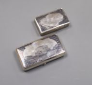 A 19th century Russian 84 zolotnik and niello cigarette case, decorated with Moscow? scene, dated