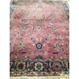 A Persian style plum ground carpet 245 x 295cm