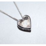 A modern 9ct white gold and diamond set heart shaped pendant necklace, pendant 6mm.