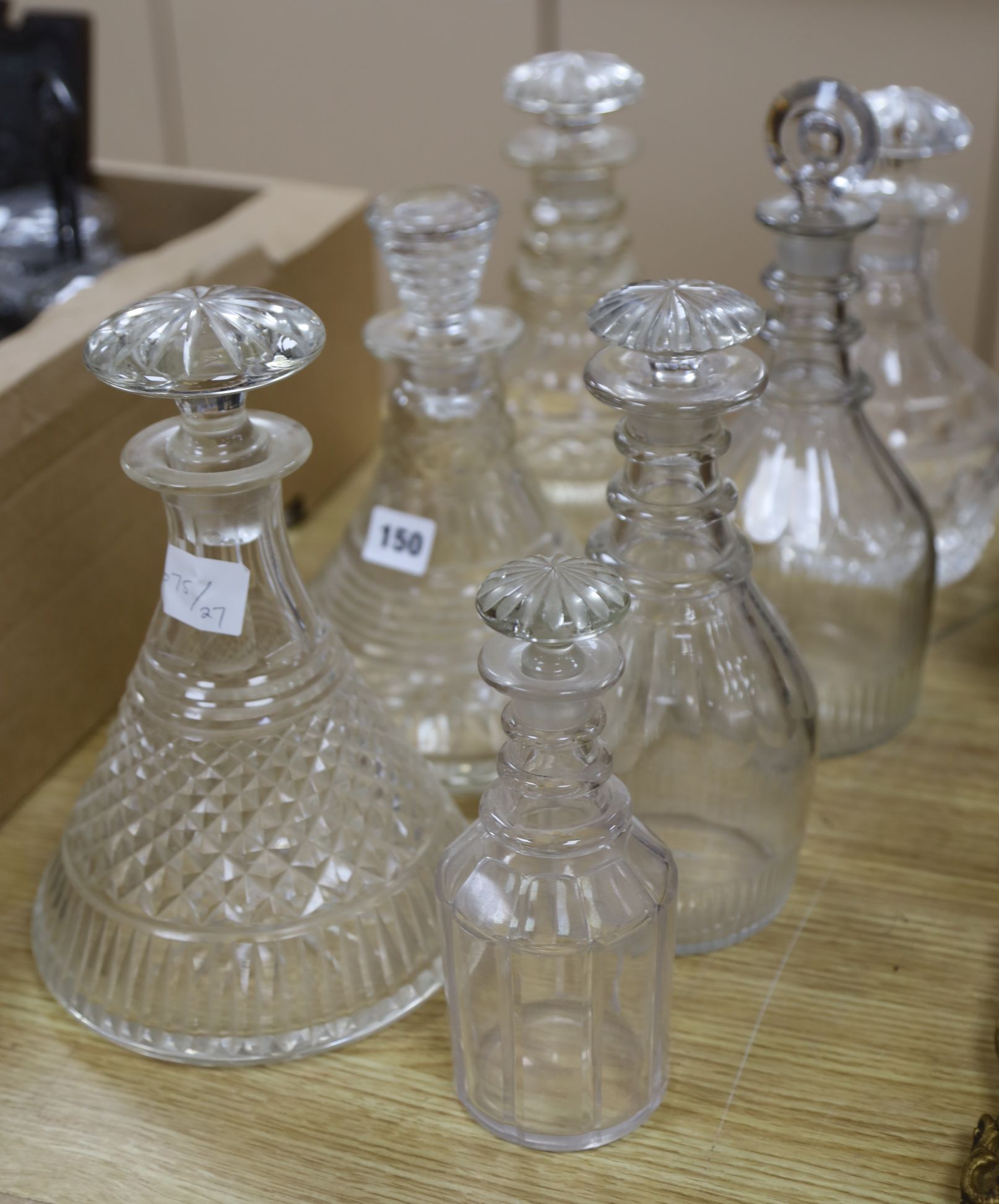 Seven various cut glass decanters