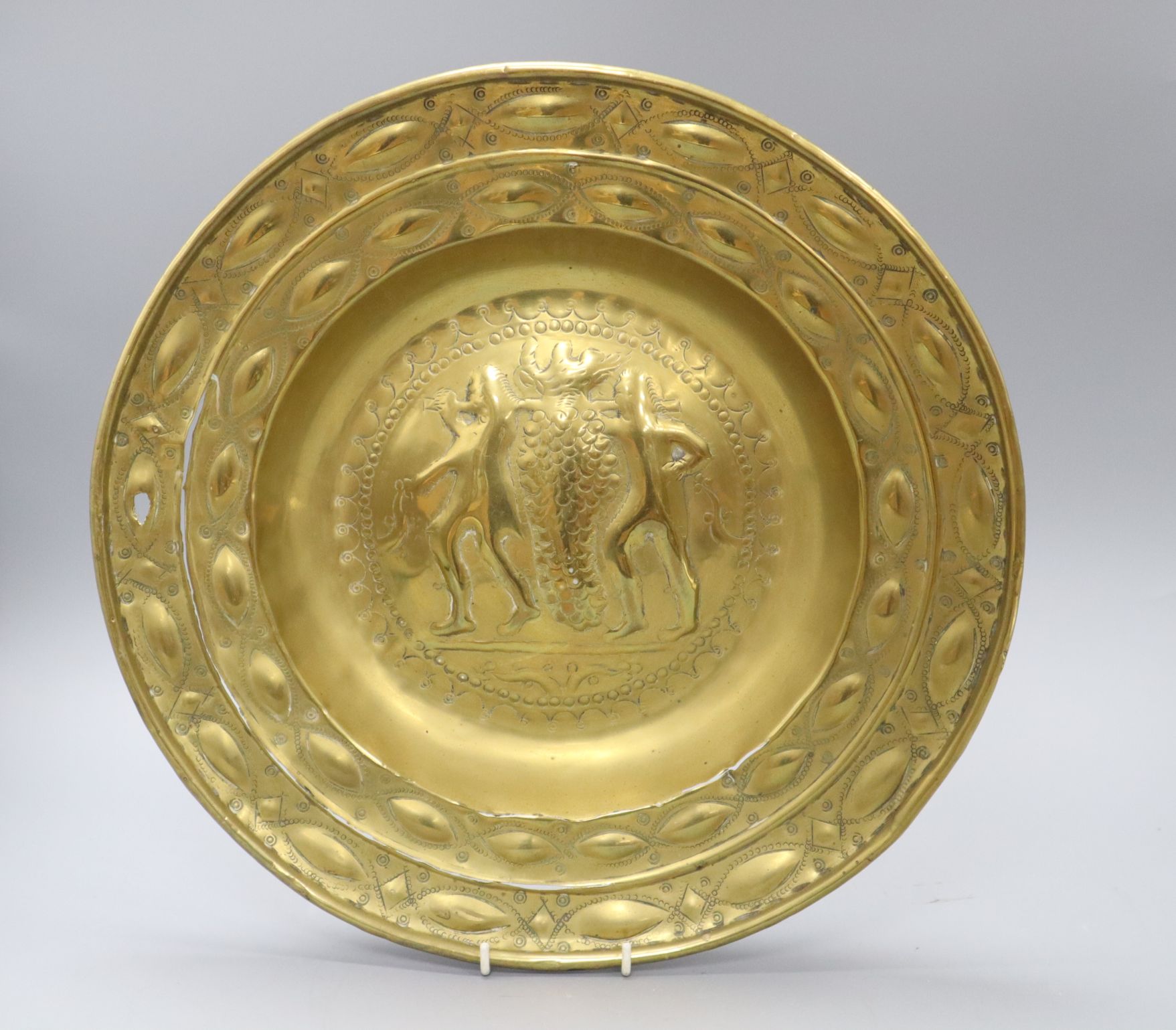 A 19th century embossed brass dish, etched to the reverse "To the use of Lexden Church as a Thank