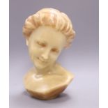 A wax bust of a girl H.30cm