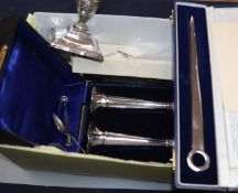 A cased pair of silver spill vases(a.f.),a dwarf candlestick, paperknife and minor flatware.