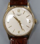 A gentleman's 1960's 9ct gold Longines manual wind wrist watch, with Arabic and baton numerals, on