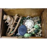 A wooden box containing assorted jewellery etc.