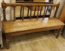 A Victorian oak hall seat L.133cm