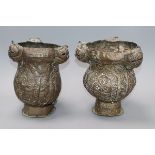 A pair of Indian embossed brass incense burners H.22cm