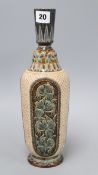 A Doulton Lambeth slender bottle vase, by Florence E Lewis, dated 1879, with foliate panels on a