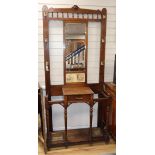 An Edwardian walnut hallstand W.92cm