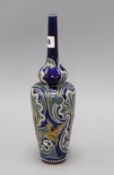 A Doulton Lambeth tall slender bottle vase, by Edith D Lupton, no. 966 with incised shell and