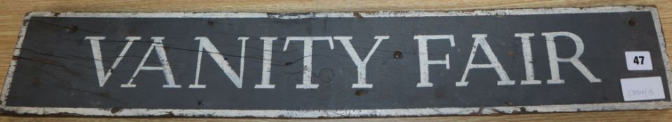 A painted 'Vanity Fair' sign L.80cm