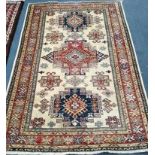 A Kazak fawn ground rug 185 x 125cm
