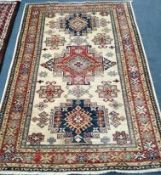 A Kazak fawn ground rug 185 x 125cm