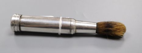 A Victorian silver travelling shaving brush, London, 1890 (cap missing), overall 16cm.