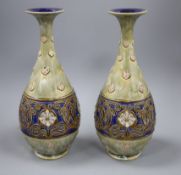 A pair of large Royal Doulton stoneware bottle vases, c.1905, with flower and Art Nouveau style
