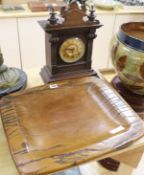 An American mantel clock and a carved hardwood dish