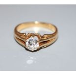 An early 20th century 18ct gold and claw set solitaire diamond ring (stone chipped), diamond