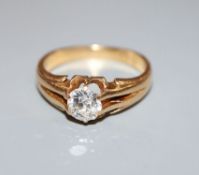 An early 20th century 18ct gold and claw set solitaire diamond ring (stone chipped), diamond