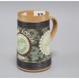 An unusual Doulton Lambeth 'tortoise & hare' mug, inscribed 'Pearl Adelia 1886', with green relief