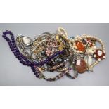 A mixed group of assorted costume jewellery including an amethyst bead necklace.