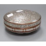 A 19th century Cairo ware silver overlaid copper box and cover Diameter 17cm. approx.