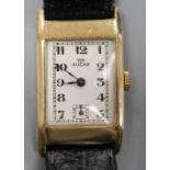 A gentleman's early 1940's 9ct gold Audax manual wind wrist watch, with rectangular Arabic dial