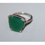 An 18ct, plat and chrysophase? or green paste set dress ring, size L.