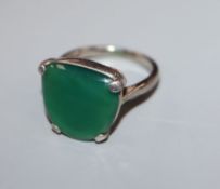 An 18ct, plat and chrysophase? or green paste set dress ring, size L.