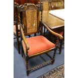 A set of six 1920's Carolean design carved beech dining chairs (2 with arms)