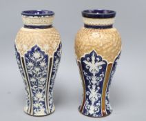 Two similar Doulton Lambeth baluster vases, c.1900, each decorated with arched panels of foliage and