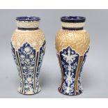 Two similar Doulton Lambeth baluster vases, c.1900, each decorated with arched panels of foliage and