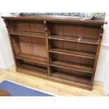 A Victorian mahogany four shelf open fronted bookcase, fitted four shelves, in two sections W.182cm