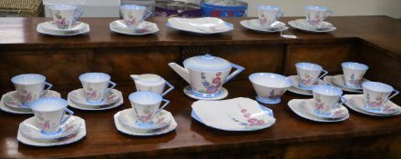 A 1930's Shelley 12 place setting tea set with tea pot and sandwich plates