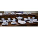 A 1930's Shelley 12 place setting tea set with tea pot and sandwich plates