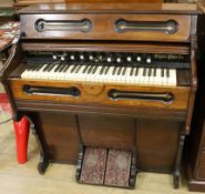 A 19th century American walnut cased cottage organ W.108cm