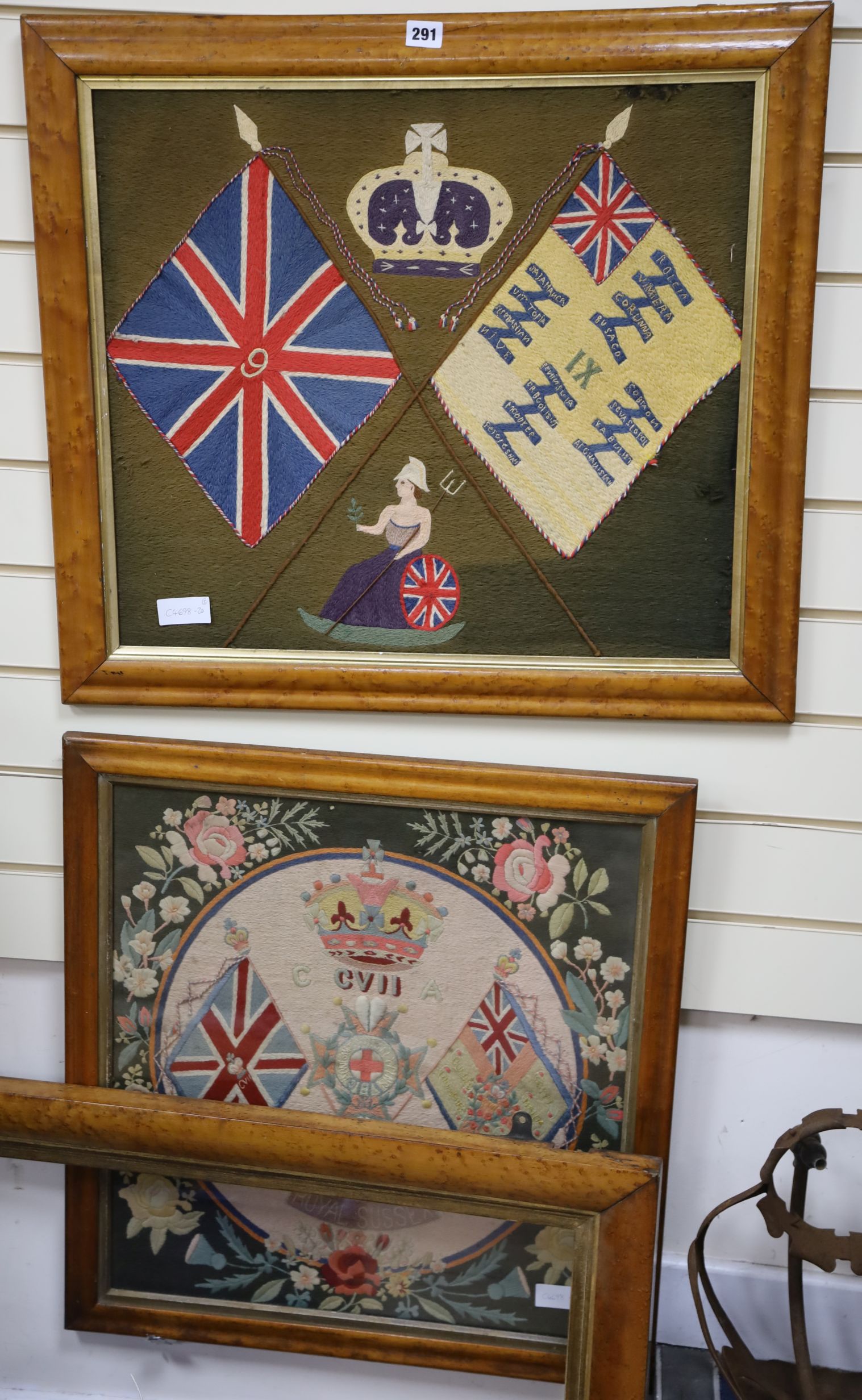 Two military woolwork panels and frame