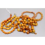 A single strand amber bead necklace, gross 15 grams, one clear amber necklace and two amberoid