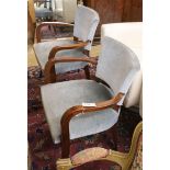 A pair of French Art Deco style beech elbow chairs