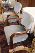 A pair of French Art Deco style beech elbow chairs